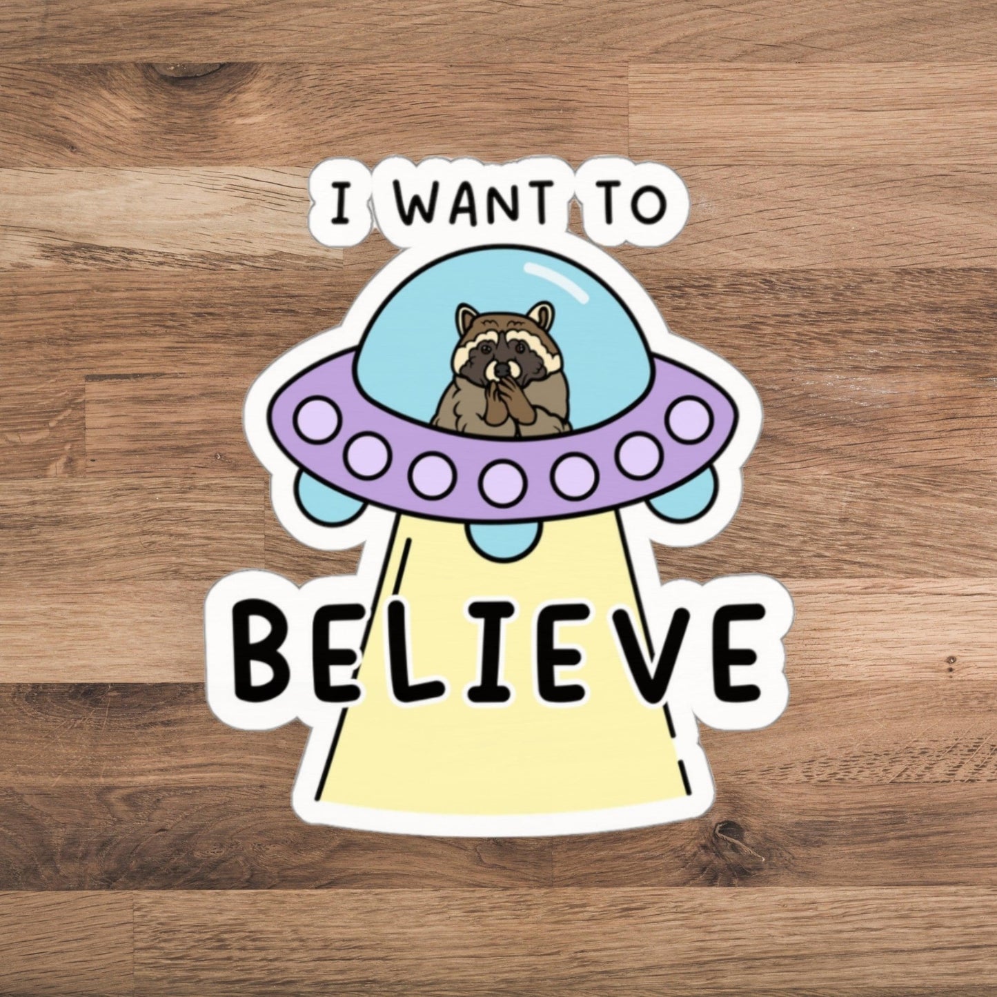 I Want to Believe - Funny Alien UFO Raccoon Meme Sticker - Just Goofy Little Guys