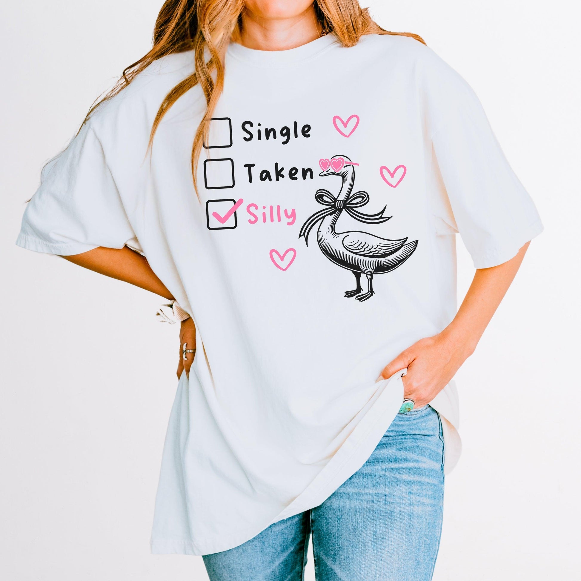 Silly Goose Valentine's Day Shirt - Just Goofy Little Guys  T-Shirt Forget romance—it’s all about embracing your silly side this Valentine’s Day! Our “Single, Taken, Silly” tee features a playful design with checkboxes and the “silly” box proudly checked. Perfect for the goofy, fun-loving folks who prefer laughs over love songs. Made with soft Comfort Colors cotton, this unisex shirt is ideal for Valentine’s Day celebrations, Galentine’s hangouts, or just showing off your silly goose vibes all year round. 